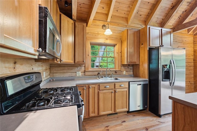 365 Hemlock Bnd, Emlenton, PA 16373 - kitchen with appliances with stainless steel finishes, a sink, wood ceiling, wood walls, and light wood-style flooring