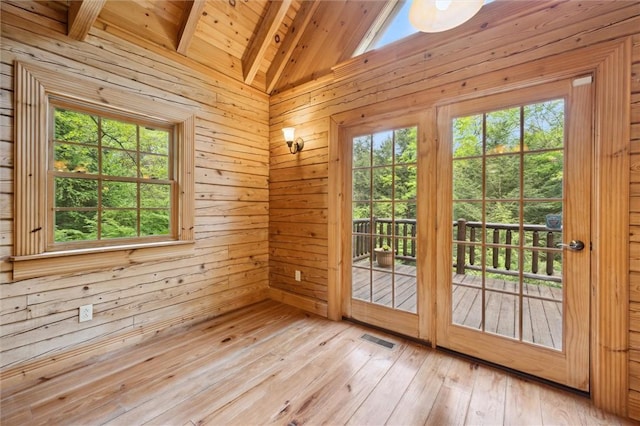 365 Hemlock Bnd, Emlenton, PA 16373 - doorway with wooden ceiling, healthy amount of natural light, wooden walls, and light wood finished floors