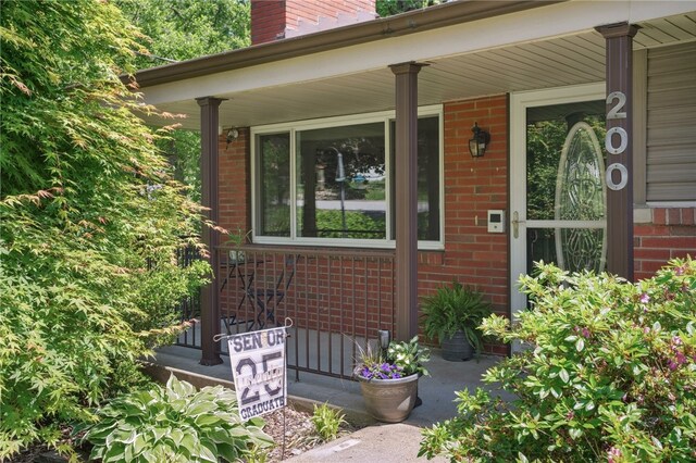 200 Dorseyville Rd, Ohara, PA 15215 - entrance to property featuring covered porch, brick siding, and a chimney