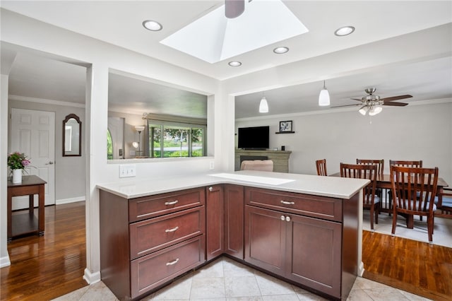 200 Dorseyville Rd, Ohara, PA 15215 - kitchen featuring a ceiling fan, light countertops, ornamental molding, a skylight, and recessed lighting