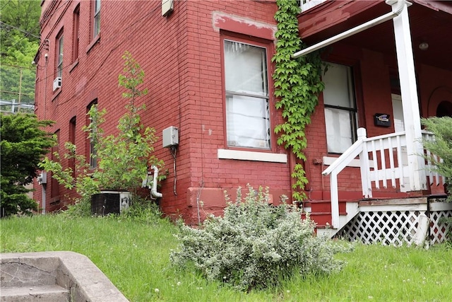 518 Middle Ave, Wilmerding, PA 15148 - view of home's exterior featuring brick siding and cooling unit
