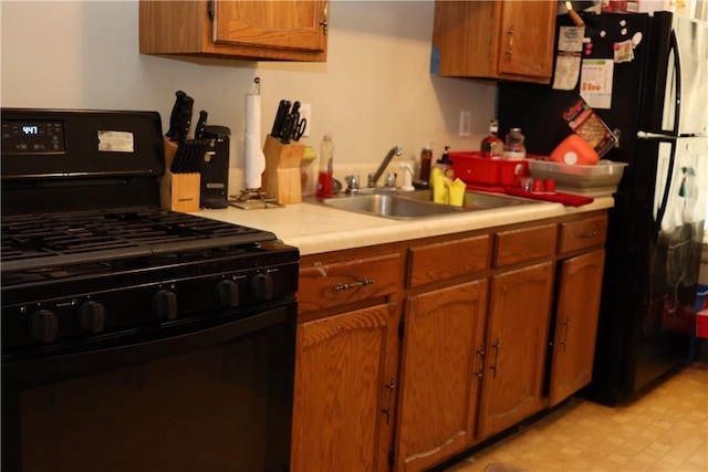 518 Middle Ave, Wilmerding, PA 15148 - kitchen featuring black appliances, a sink, and brown cabinets