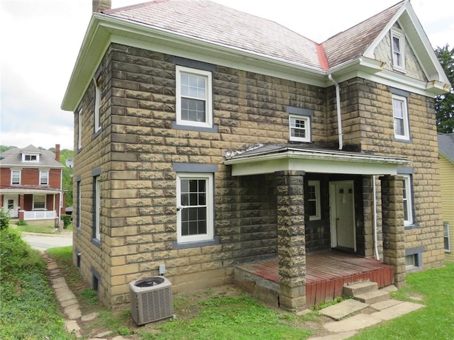 802 Howard St, Monongahela, PA 15063 - back of house with central AC unit, covered porch, and stone siding