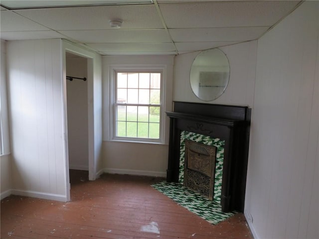 802 Howard St, Monongahela, PA 15063 - unfurnished living room featuring a paneled ceiling, wood-type flooring, baseboards, and a fireplace