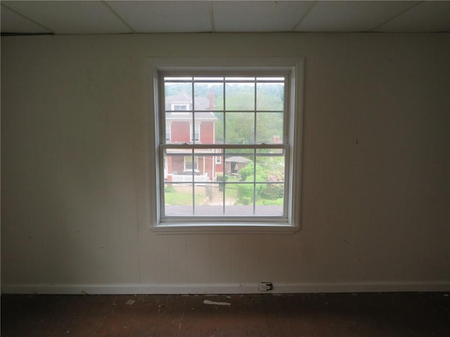 802 Howard St, Monongahela, PA 15063 - unfurnished room with baseboards, plenty of natural light, wood-type flooring, and a paneled ceiling