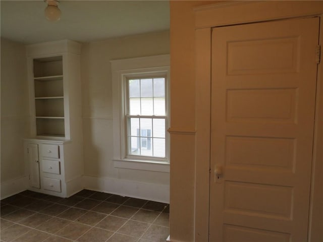 802 Howard St, Monongahela, PA 15063 - spare room featuring dark tile patterned floors and baseboards