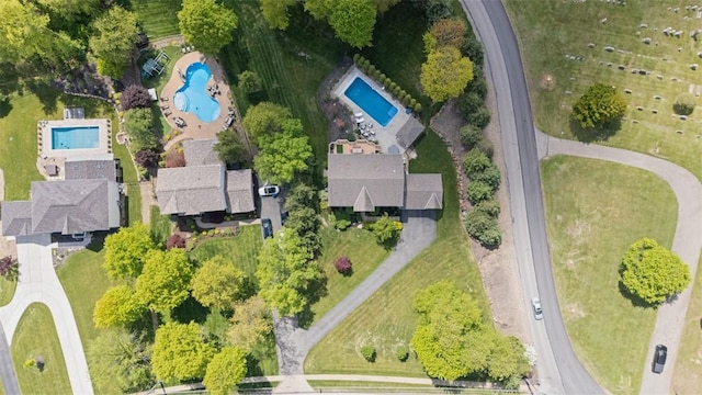 aerial view of property and surrounding area with a pool