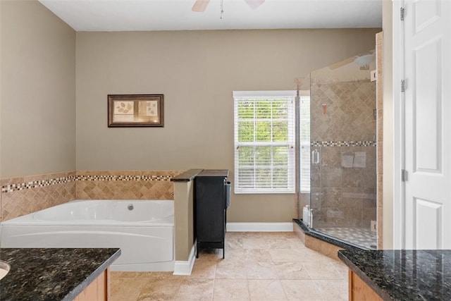 bathroom with vanity, a shower stall, a bath, and tile patterned flooring