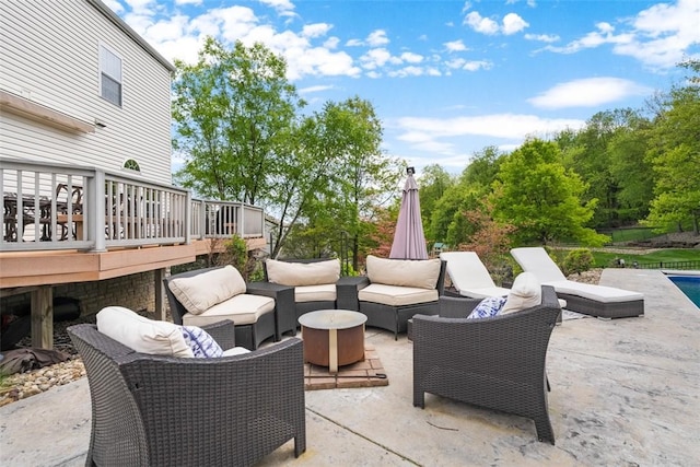 view of patio with an outdoor living space and a wooden deck