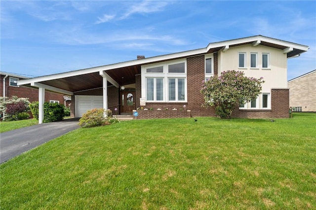 116 Tangelo Dr, Jefferson Hills, PA 15025 - view of front of property with an attached carport, brick siding, an attached garage, a front yard, and driveway