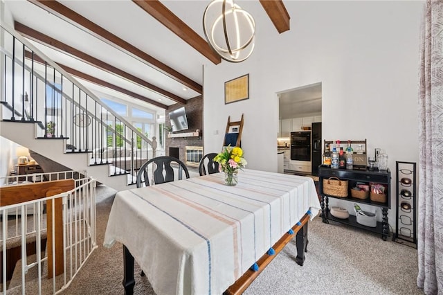 116 Tangelo Dr, Jefferson Hills, PA 15025 - dining room featuring carpet floors, beam ceiling, a brick fireplace, stairway, and high vaulted ceiling