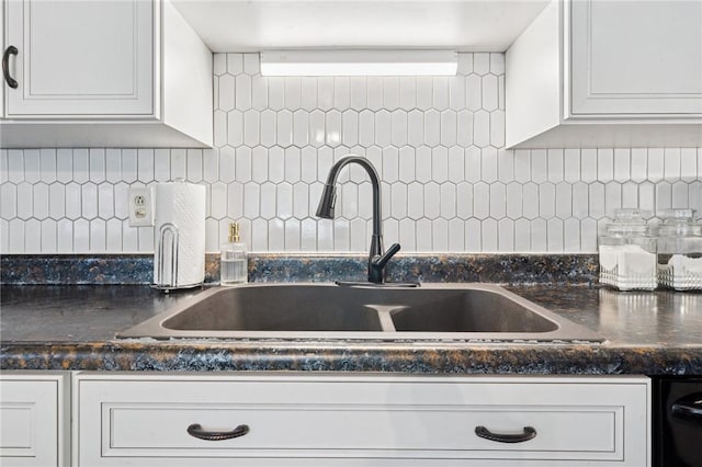 116 Tangelo Dr, Jefferson Hills, PA 15025 - kitchen with a sink, dark countertops, white cabinets, and decorative backsplash