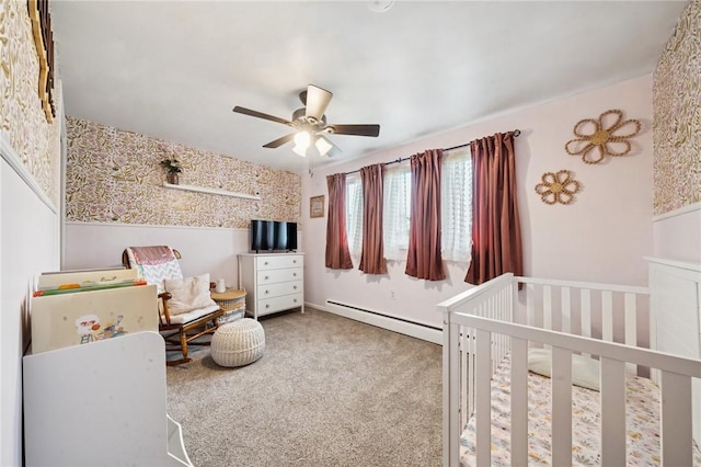 116 Tangelo Dr, Jefferson Hills, PA 15025 - carpeted bedroom featuring a baseboard heating unit, a nursery area, a ceiling fan, and wallpapered walls