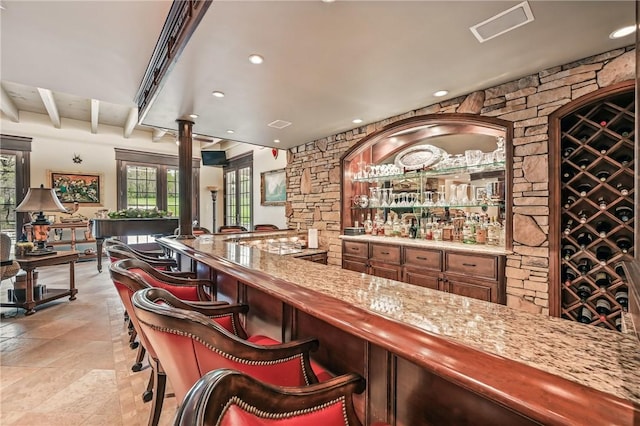 indoor wet bar featuring recessed lighting and beamed ceiling