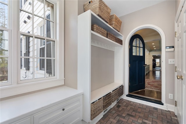 265 Scaife Rd, Sewickley Heights, PA 15143 - mudroom with brick patterned flooring, arched walkways, and baseboards