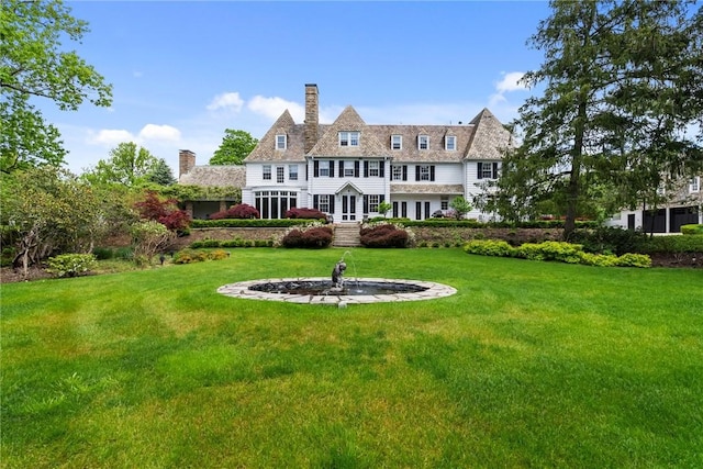 265 Scaife Rd, Sewickley Heights, PA 15143 - back of house featuring a chimney, french doors, and a lawn