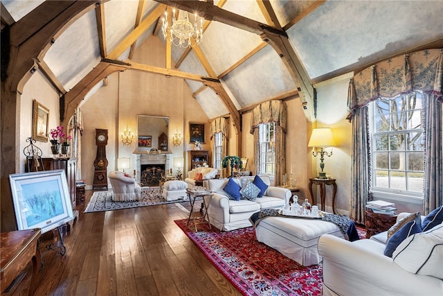 265 Scaife Rd, Sewickley Heights, PA 15143 - living room with healthy amount of natural light, high vaulted ceiling, wood-type flooring, a fireplace, and a chandelier