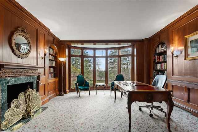 265 Scaife Rd, Sewickley Heights, PA 15143 - office featuring built in shelves, wooden walls, ornamental molding, carpet floors, and a high end fireplace