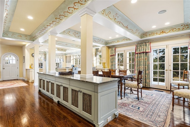 265 Scaife Rd, Sewickley Heights, PA 15143 - interior space with decorative columns, dark stone countertops, dark wood-style flooring, a center island, and french doors
