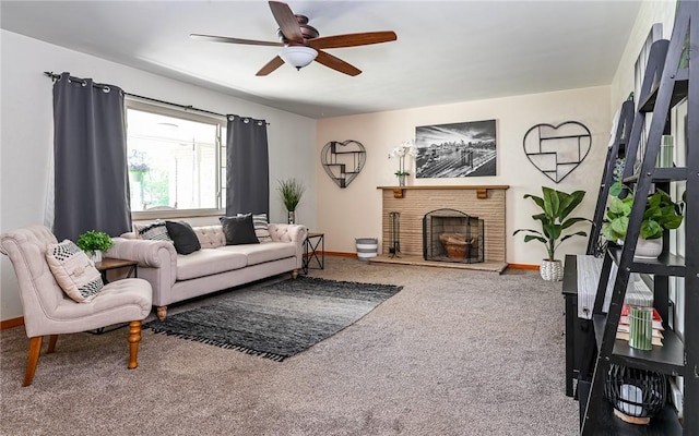 carpeted living room featuring ceiling fan, baseboards, and a fireplace with raised hearth