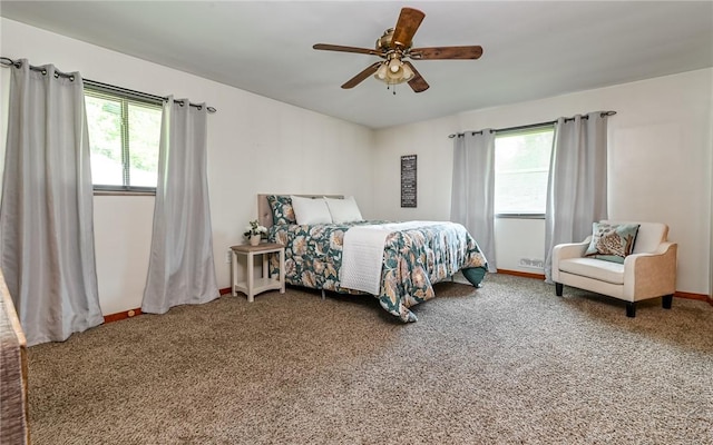 carpeted bedroom with baseboards and ceiling fan
