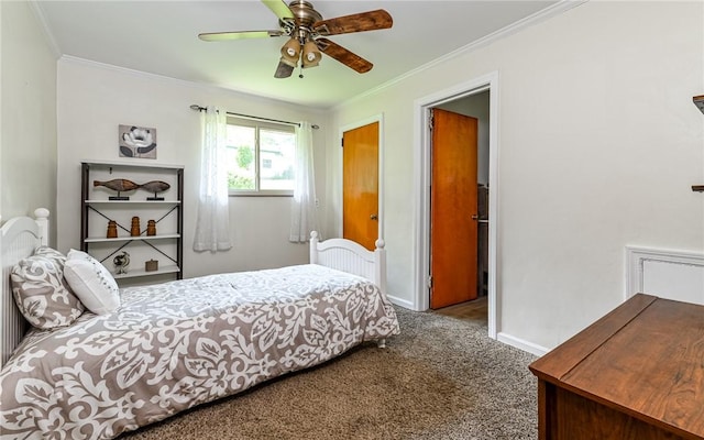 carpeted bedroom with ornamental molding, baseboards, and ceiling fan