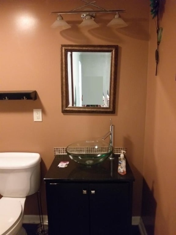 41 Sylvia Ave, Ross Twp, PA 15214 - bathroom featuring vanity, toilet, and baseboards