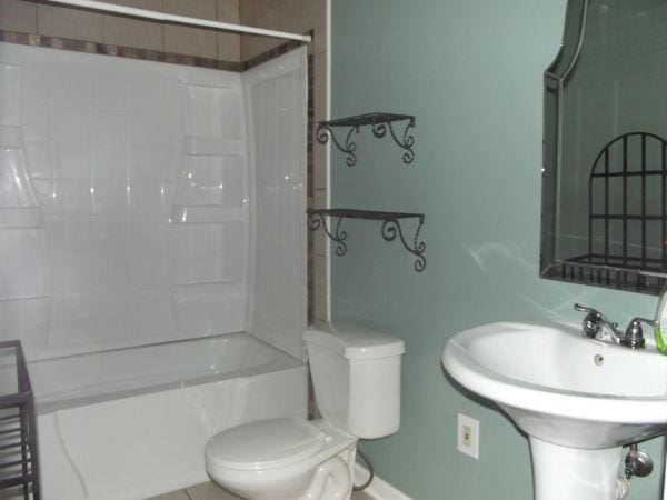 41 Sylvia Ave, Ross Twp, PA 15214 - bathroom featuring toilet, a sink, and  shower combination