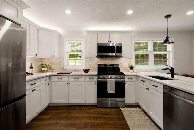 3334 Comanche Rd, Upper St Clair, PA 15241 - kitchen with appliances with stainless steel finishes, a sink, recessed lighting, dark wood-type flooring, and tasteful backsplash