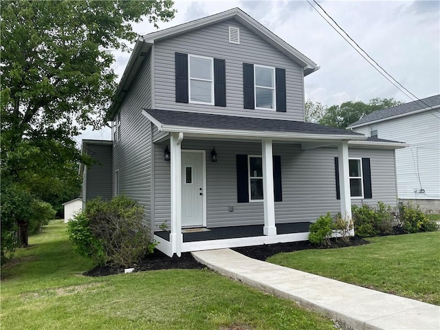 1215 Main St, Bentleyville, PA 15314 - view of front of property with a porch and a front lawn