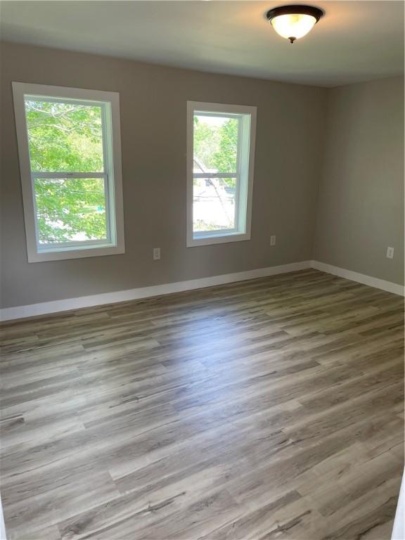 1215 Main St, Bentleyville, PA 15314 - spare room with baseboards and wood finished floors