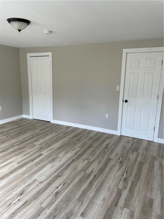 1215 Main St, Bentleyville, PA 15314 - spare room featuring wood finished floors and baseboards