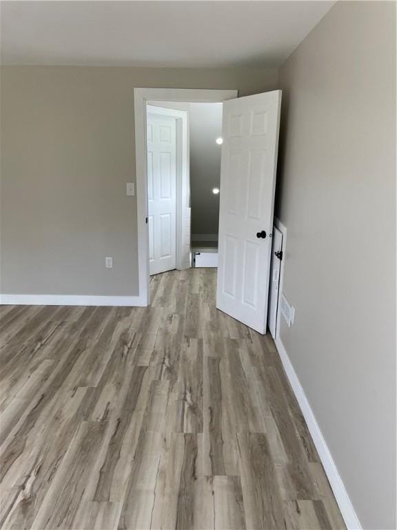 1215 Main St, Bentleyville, PA 15314 - empty room featuring wood finished floors and baseboards