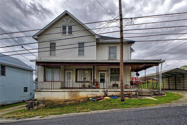 257 Lavansville Rd, Somerset Twp, PA 15501 - view of front facade with a porch and a carport