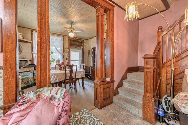 257 Lavansville Rd, Somerset Twp, PA 15501 - carpeted foyer with stairway, a ceiling fan, and a chandelier