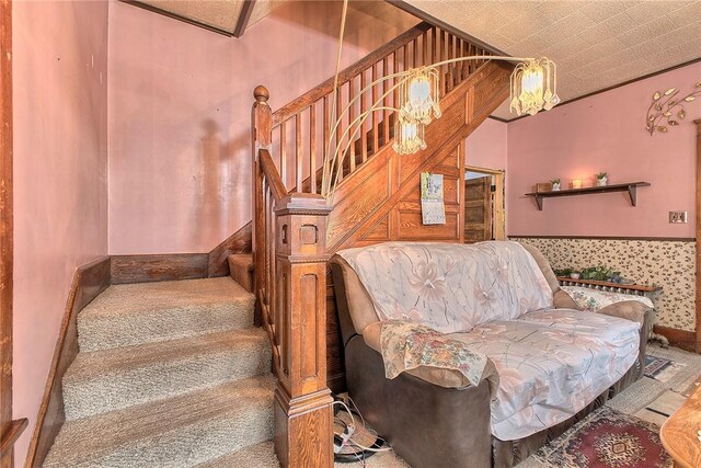 257 Lavansville Rd, Somerset Twp, PA 15501 - stairs featuring a chandelier and carpet floors