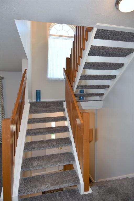 stairway with baseboards
