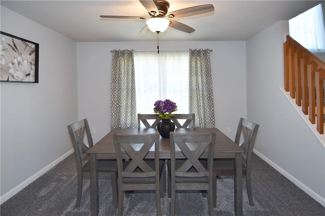 dining space featuring healthy amount of natural light, baseboards, carpet flooring, and ceiling fan