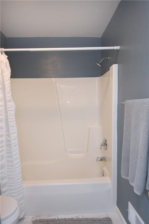 full bath featuring shower / tub combo and toilet