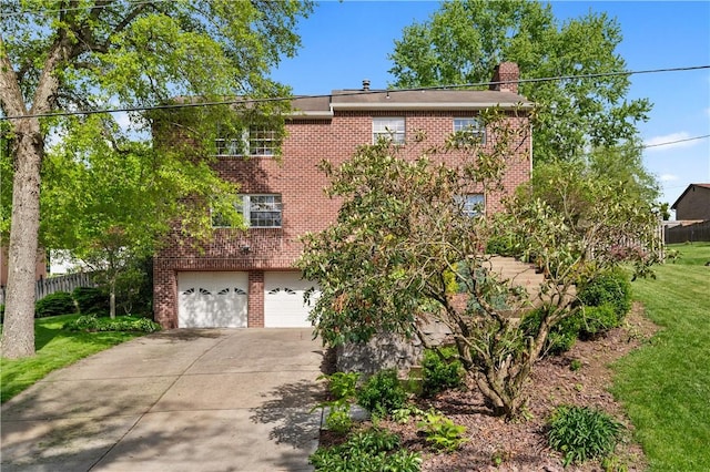 3 Patricia St, Fallowfield, PA 15022 - view of front facade with brick siding, concrete driveway, a garage, and a chimney