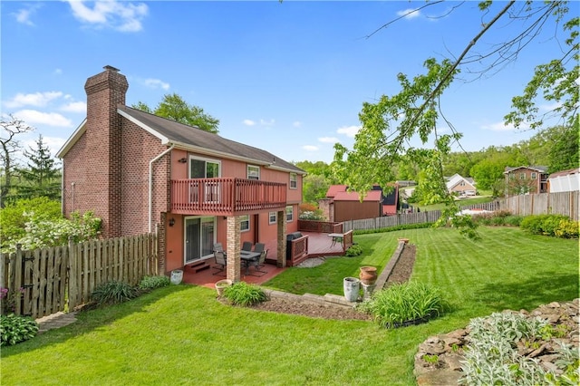 3 Patricia St, Fallowfield, PA 15022 - back of property featuring a chimney, a patio, and a deck