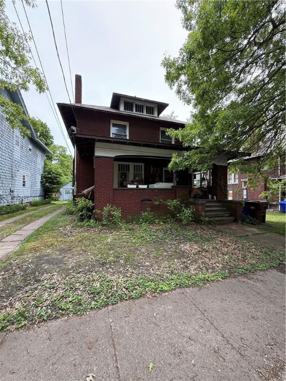 121 Clinton St, Greenville Boro Mer, PA 16125 - american foursquare style home with a chimney, a porch, and brick siding