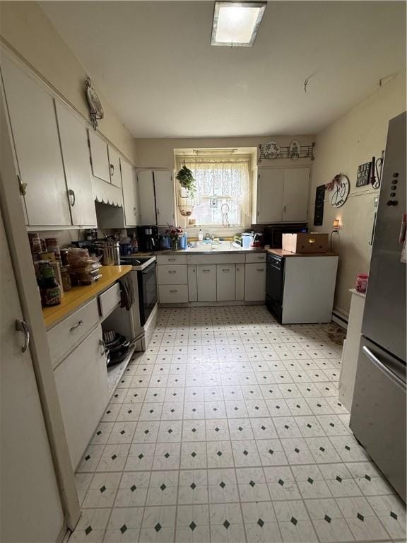 121 Clinton St, Greenville Boro Mer, PA 16125 - kitchen with freestanding refrigerator, stove, range with electric cooktop, and light countertops