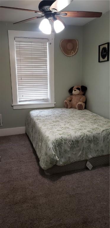 bedroom featuring carpet floors, baseboards, and ceiling fan