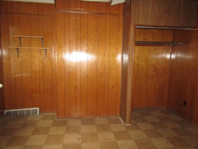 2101 Wharton St, South Side, PA 15203 - empty room featuring tile patterned floors and wood walls