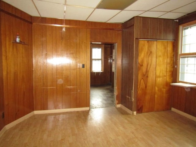 2101 Wharton St, South Side, PA 15203 - unfurnished room featuring wood finished floors, wooden walls, baseboards, and a paneled ceiling