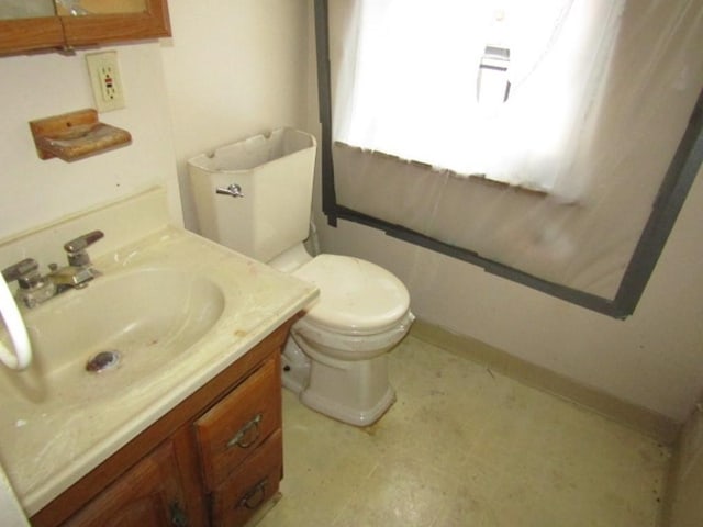 2101 Wharton St, South Side, PA 15203 - half bathroom with toilet, tile patterned floors, vanity, and baseboards
