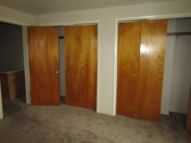 2101 Wharton St, South Side, PA 15203 - unfurnished bedroom featuring carpet floors and two closets