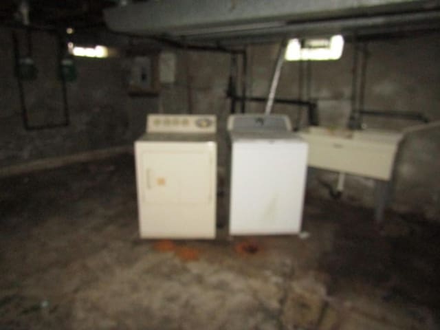 2101 Wharton St, South Side, PA 15203 - unfinished basement with washing machine and clothes dryer and a sink