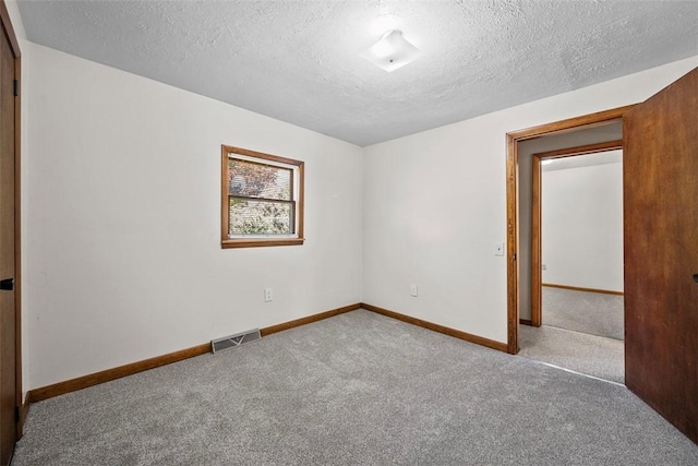 2918 Woodland Cir, Hampton, PA 15101 - unfurnished room with carpet, a textured ceiling, and baseboards